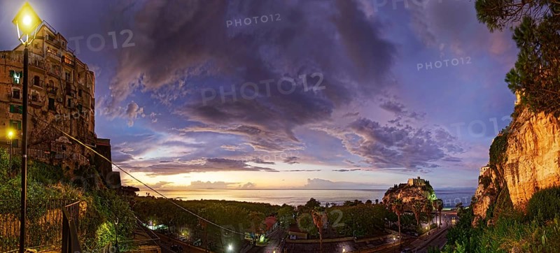 Sea view with the medieval old town of Tropeain the evening twilight, Tropea, Calabria, Vibo Valentia, Southern Italy, Italy, Europe