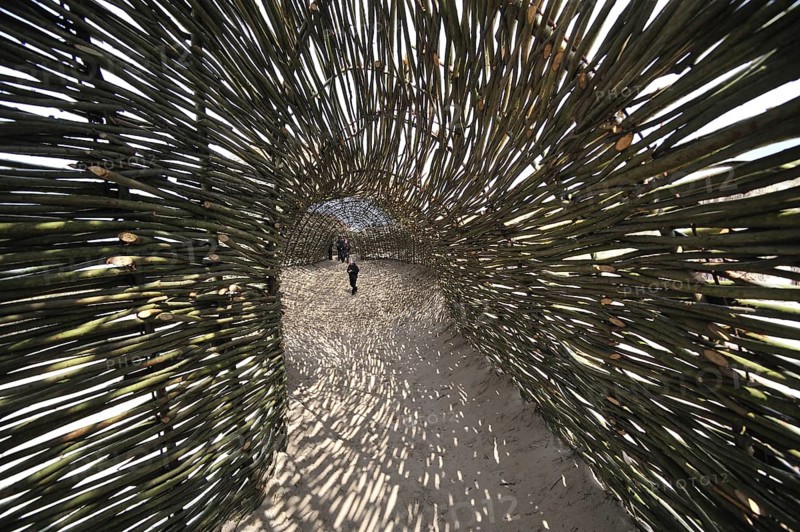 Sandworm by artist Marco Casagrande in the dunes during Beaufort04 at De Haan, Wenduine, Belgium, Europe