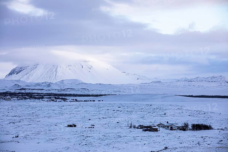 Snow-covered extinct volcano Hverfjall, lonely farmhouse in front, near Lake Myvatn, Northern Ireland Eyestra, Iceland, Europe