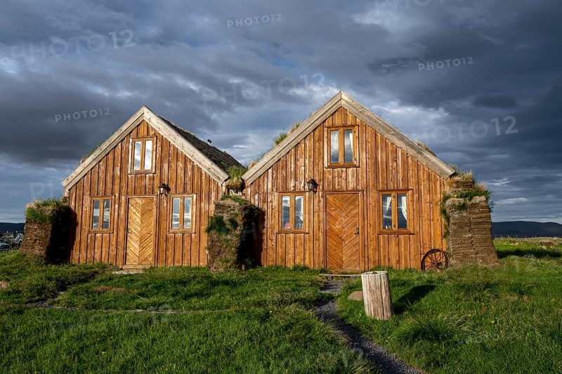 Traditional wooden peat houses with grass on the roof, in the evening light, Möðrudalur, Icelandic highlands, Iceland, Europe