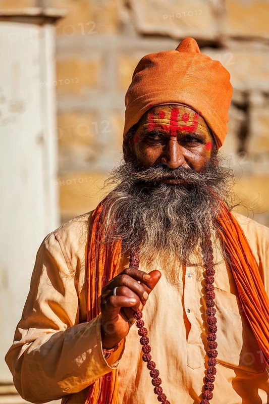 JAISALMER, INDIA, NOVEMBER 28, 2012: Indian sadhu (holy man) blessing. Sadhus are holy men who live ascetic life and focus on spiritual practice of Hinduism