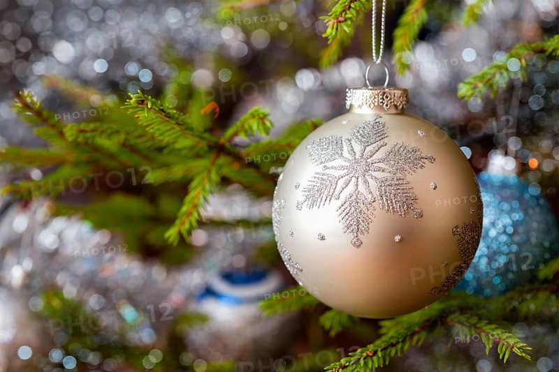 Christmas celebration holiday background, christmas-tree decoration bauble on decorated Christmas tree with defocused blurred lights bokeh and copyspalce