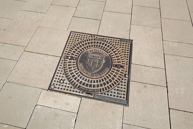 Manhole cover with city coat of arms and inscription County town Limburg a. d. Lahn, Europaplatz, Old Town, Limburg, Hesse, Germany, Europe