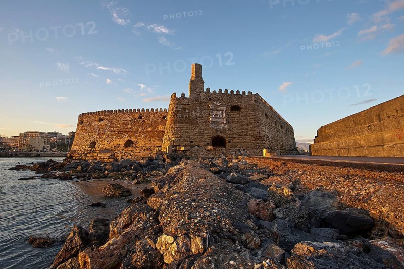 Sunset, evening light, backlight, Venetian sea fortress, Koules, Morosini, mountains, bronze sky, harbour, Heraklion, capital, island of Crete, Greece, Europe