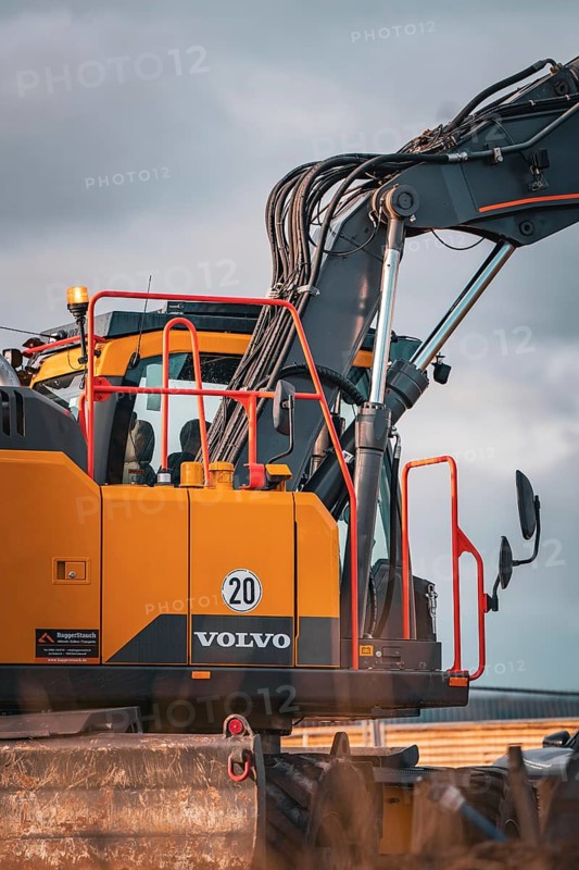 Yellow Volvo tracked excavator on construction site
