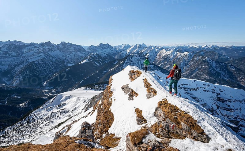 Two ski tourers at the summit of Schafreuter, view of snowy mountain panorama, Karwendel, Tyrol, Austria, Europe