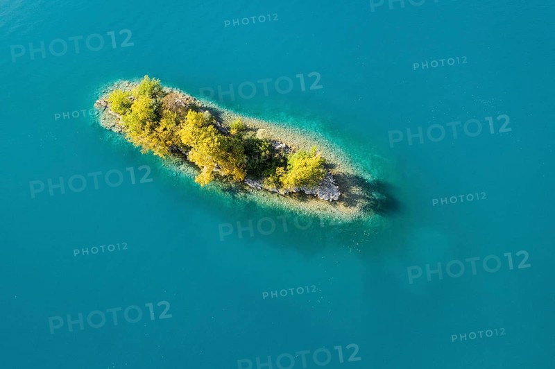 Bird's eye view of the chive island in the turquoise waters of Lake Walen in the canton of St. Gallen, Switzerland, Europe