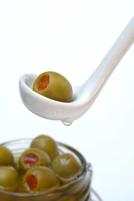 Green olive stuffed with pieces of paprika
