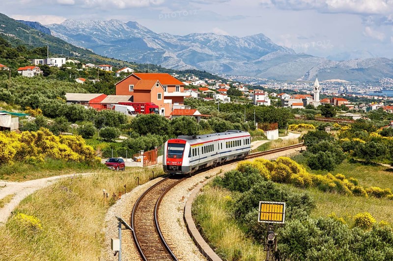 Local train with tilting technology of the Croatian railway Hrvatske Zeljeznice in Kaštel Stari, Croatia, Europe