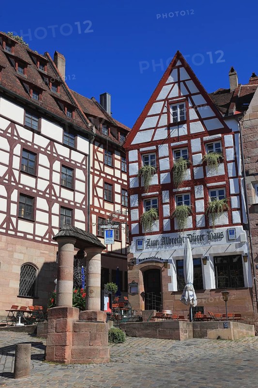 In the old town of Nuremberg, the Pilatus House with St George as dragon slayer, town house from the late Gothic period (left), then the restaurant, Zum Albrecht-Dürer-Haus, houses on Tiergärtnertorplatz, Middle Franconia, Bavaria, Germany, Europe