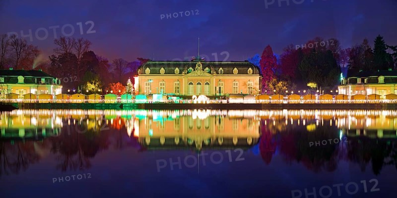 Illuminated Benrath Palace with wing building in the evening at Christmas Wunderwelt, Düsseldorf, North Rhine-Westphalia, Germany, Europe