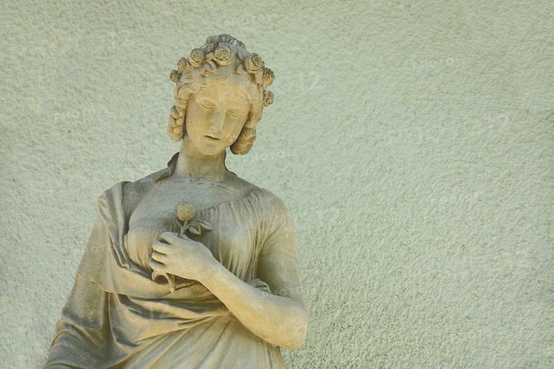 Sculpture of a woman with hair ornament and rose, flower in arm, holding hand, stone, yellow, monochrome, Opelvillen, Villa Wenske, Opelvilla, Rüsselsheim, Hesse, Germany, Europe