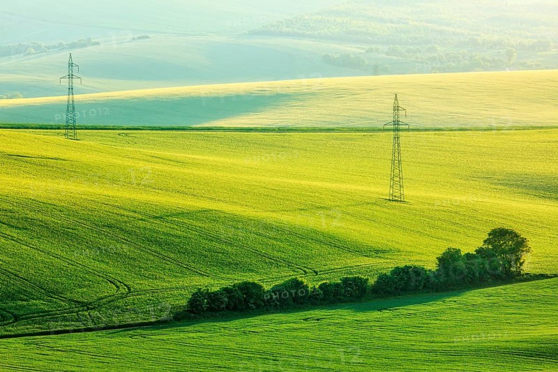 Moravian summer rolling landcsape with two power line tower. Moravia, Czech Republic, Europe
