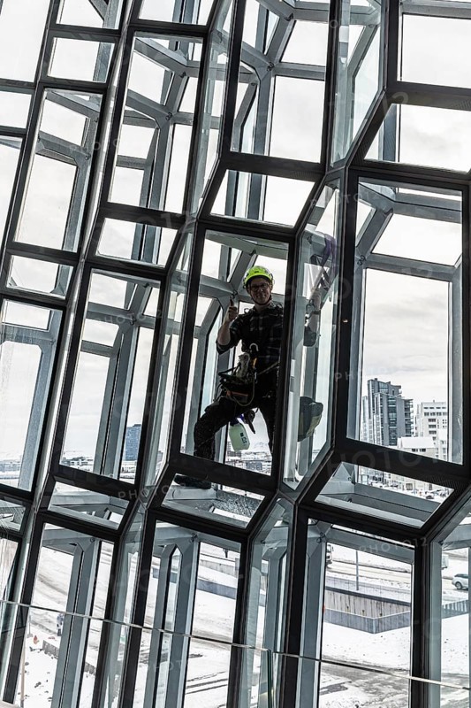 Window cleaners cleaning the glass facade of the Harpa Concert Hall and Congress Centre, interior view, Reykjanes Peninsula, Sudurnes, Iceland, Europe