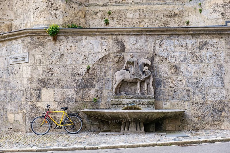 The Martin Fountain at the northeast corner of St. Martin's Church in Memmingen in Unterallgäu, Swabia, Bavaria, Germany, Europe