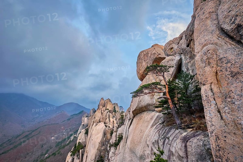 View of stone and rock formations from Ulsanbawi rock peak in stormy weather. Seoraksan National Park, South Corea