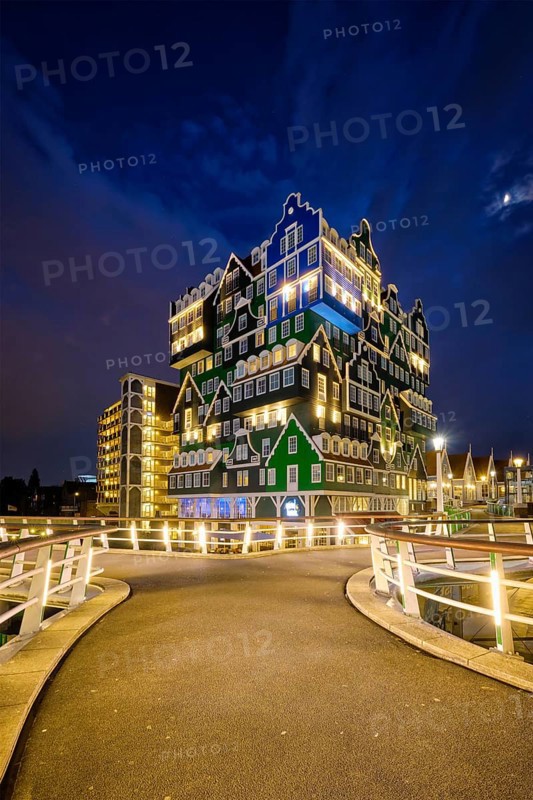ZAANDAM, NETHERLANDS, MAY 21, 2018: Inntel Hotel in Zaandam illuminated at night. Design of 12-storey tall building opened in 2009 is the result of stacking a series of traditional Dutch houses