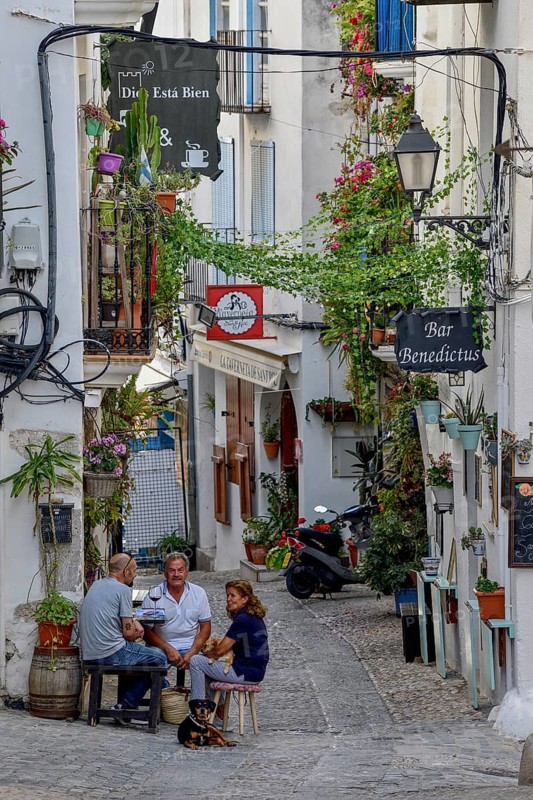 People in a sidewalk café in the old town of Peñíscola, Castellón province, Costa del Azahar, Valencia region, Spain, Europe