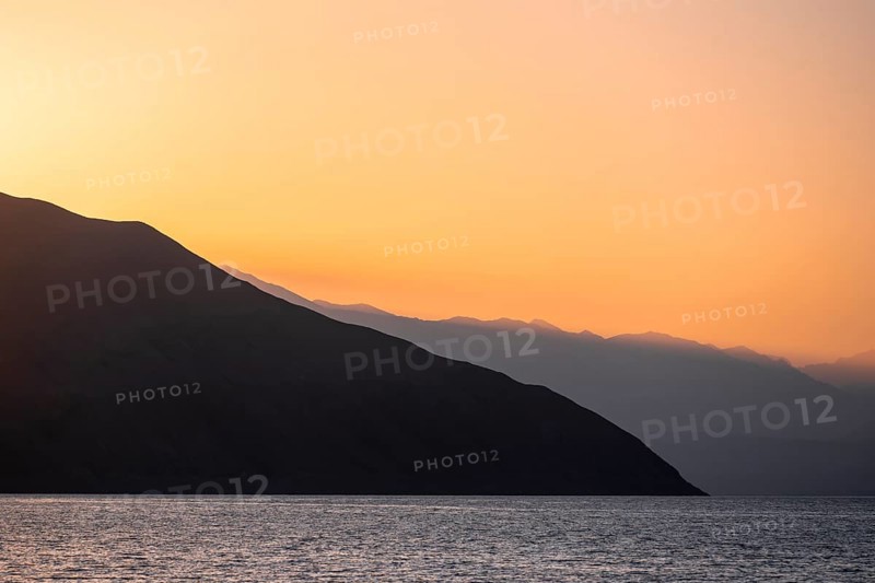 Lake and mountain landscape at sunset, Toktogul reservoir, Jalalabad region, Kyrgyzstan, Asia