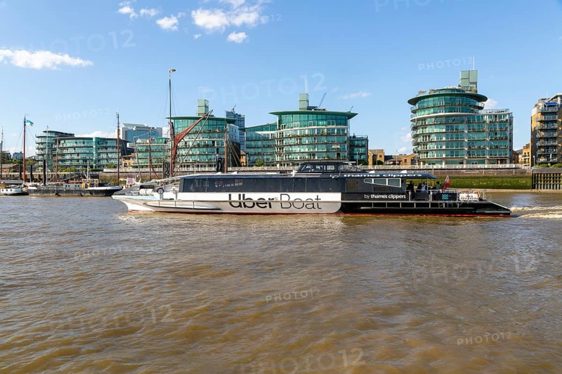 Uber boat by Thames Clippers, River Thames water bus transport service, Wapping, London, England, UK