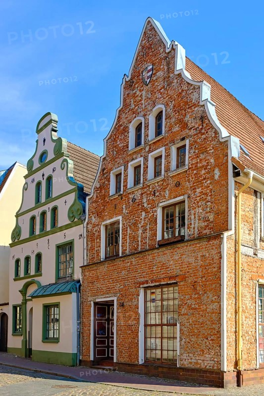 Historic 17th century Baroque gabled houses opposite the brewhouse am Lohberg at the Old Harbour in the Old Town of the Hanseatic City of Wismar, Mecklenburg-Western Pomerania, Germany, Europe