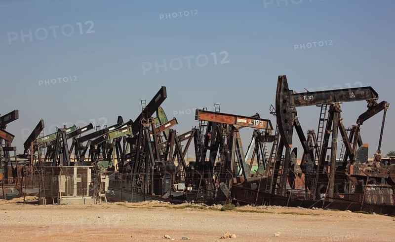 Storage with disused oil pumps near Marmul, Oman, Asia