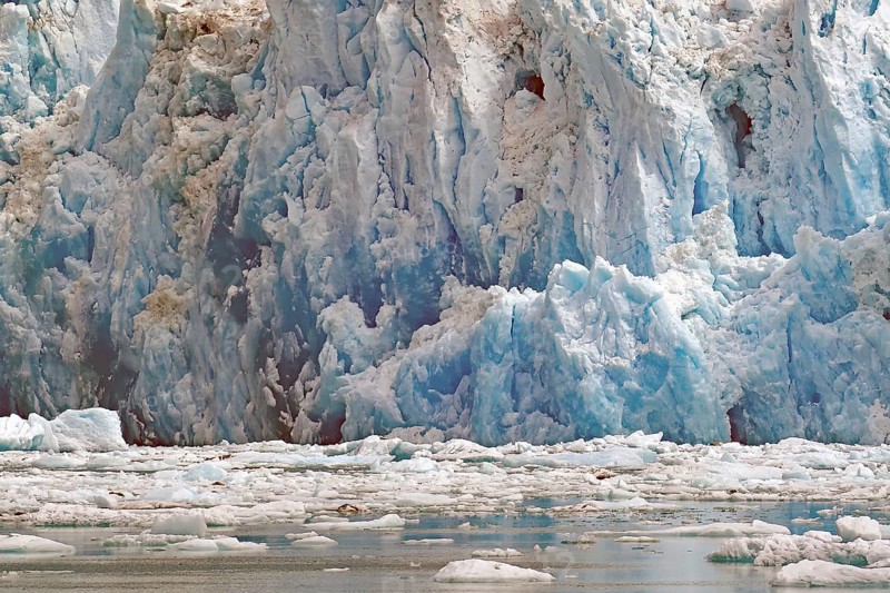 Ice of a glacier calving into the sea shimmers bluish, Tracy Arm Fiord, Tongass National Forest, Juneau, Inside Passage, Alaska, USA, North America