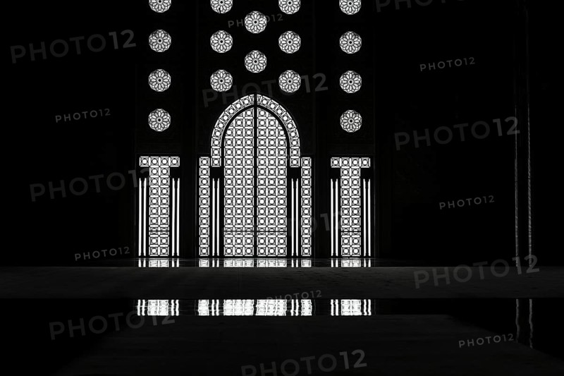 Light incidence in the darkness, interior door and window, arabesque, ornaments in the Hassan II Mosque, backlight with reflection, architecture, interior shot, black and white shot, Casablanca, Morocco, Africa
