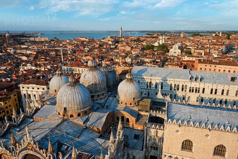 View of Venice with famous St Mark's Basilica and Doge's Palace on sunset from St Mark's Campanile bell tower, Venice, Italy, Europe
