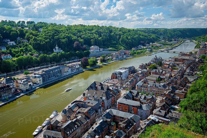 Aerial view of Dinant town, Collegiate Church of Notre Dame de Dinant, River Meuse and Pont Charles de Gaulle bridge from Dinant Citadel. Belgium