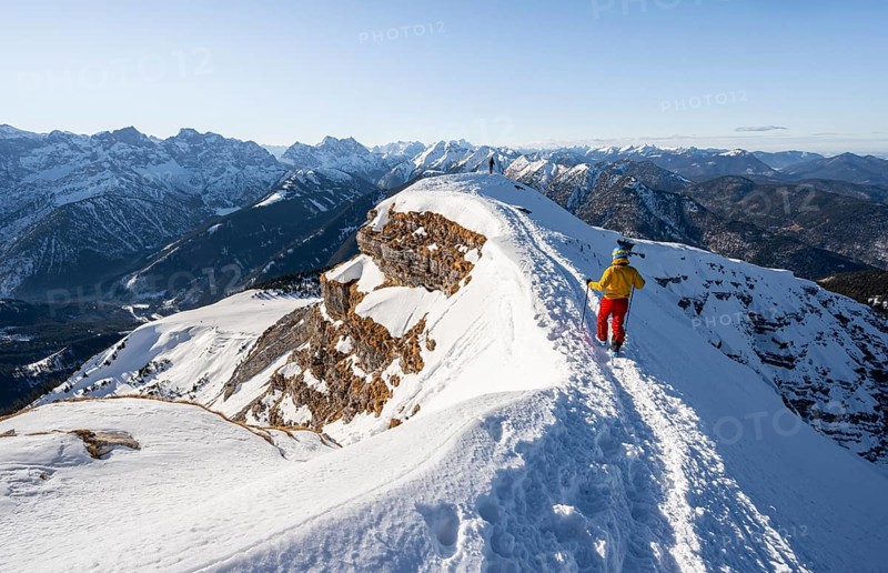 Two ski tourers at the summit of Schafreuter, view of snowy mountain panorama, Karwendel, Tyrol, Austria, Europe