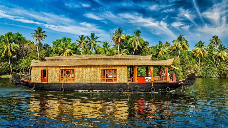 Travel tourism Kerala background, panorama of tourist houseboat on Kerala backwaters. Kerala, India, Asia