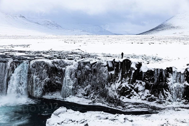 Iced and snow-covered rock face at Godafoss waterfall, snowy landscape, Northern Iceland Eyestra, Iceland, Europe