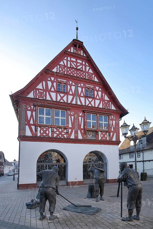 Sculptures and statues in front of the town hall in Groß-Gerau, half-timbered house, figures, harvest, workers, farmers, threshing, Hesse, Germany, Europe