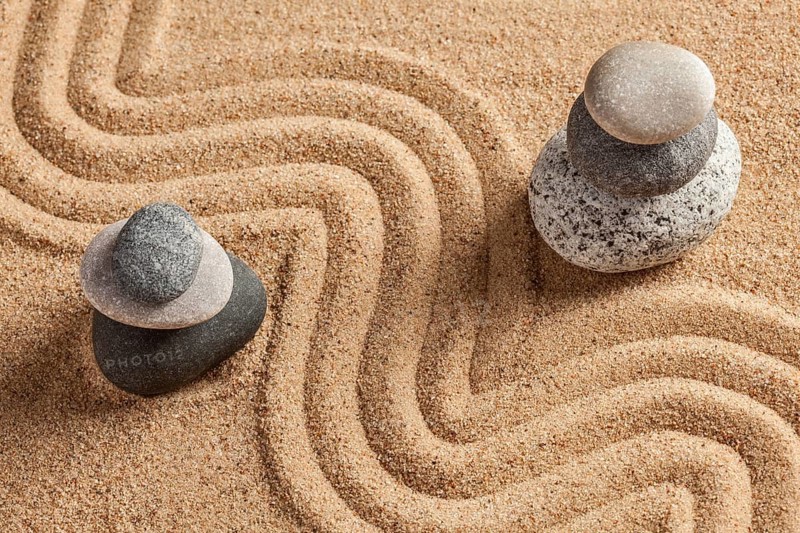 Japanese Zen stone garden, relaxation, meditation, simplicity and balance concept, pebbles and raked sand tranquil calm scene