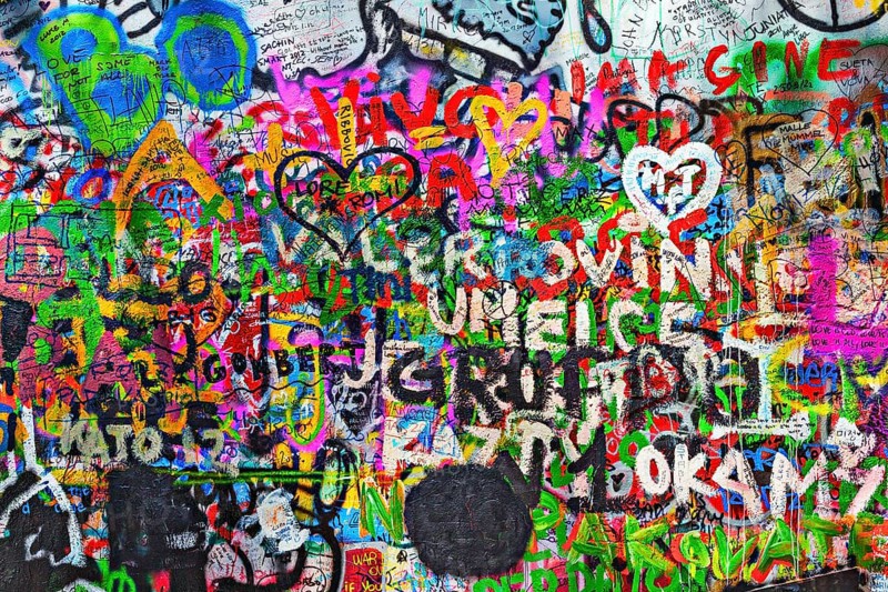 PRAGUE, CZECH REPUBLIC, APRIL 28, 2012: Lennon Wall is filled with John Lennon-inspired graffiti and pieces of lyrics from Beatles songs