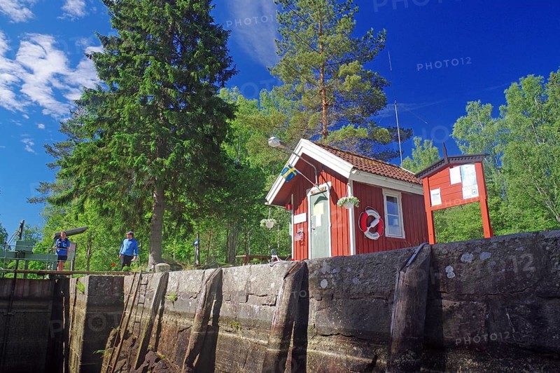 Small red wooden house in a lock, idyll, lockkeeper's house, Dalsland Canal, Sweden, Europe