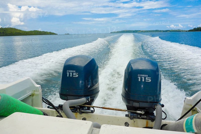 Outboard motor two outboard motors from fast boat Motor boat leaves three rows of spray white whitecap waves at stern in fairway caused by propeller, Pacific Ocean