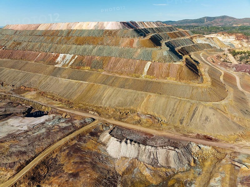 Mining waste dump and extremely mineral-rich ground and rock, scarred by the open-cast mineworkings of the Rio Tinto mines, at the town of Minas de Riotinto, aerial view, drone shot, Huelva province, Andalusia, Spain, Europe