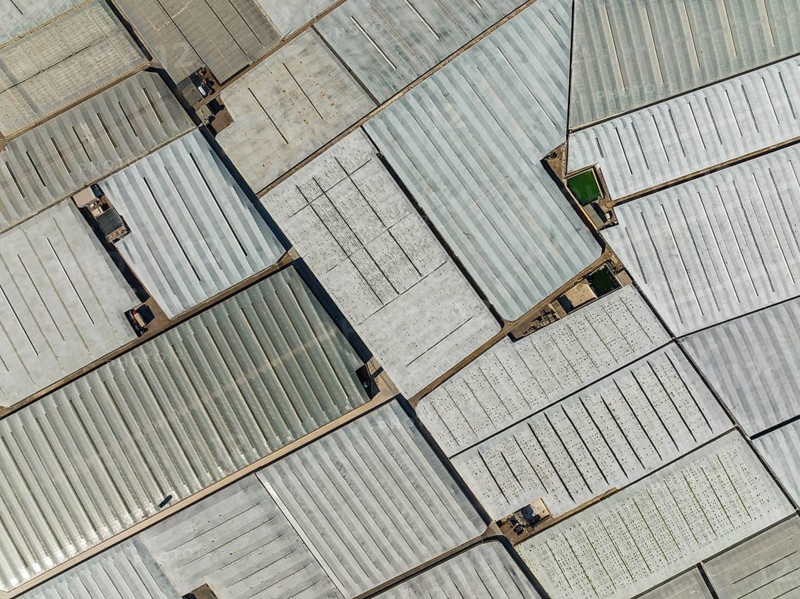 Masses of shimmering plastic greenhouses near El Ejido, aerial view, drone shot, Almería province, Andalusia, Spain, Europe
