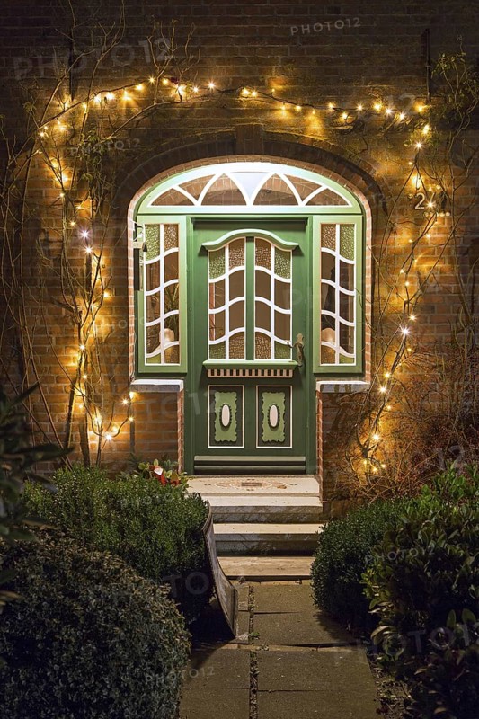 Front door of Frisian house illuminated by Christmas lights in village Toftum on the island Föhr, Foehr, North Frisia, Schleswig-Holstein, Germany, Europe