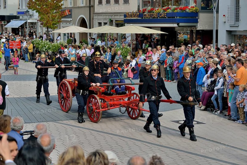 Historical firemen in uniform with an engine parading at Zwetschgenfest, plum festival, Bühl, Baden, Baden-Württemberg, Germany, Europe