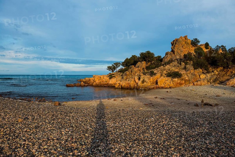 Lonely picturesque beach and red rocks, Spiaggia Su Sirboni, sunset, near Tertenia, Province of Ogliastra, Sardinia, Italy, Europe