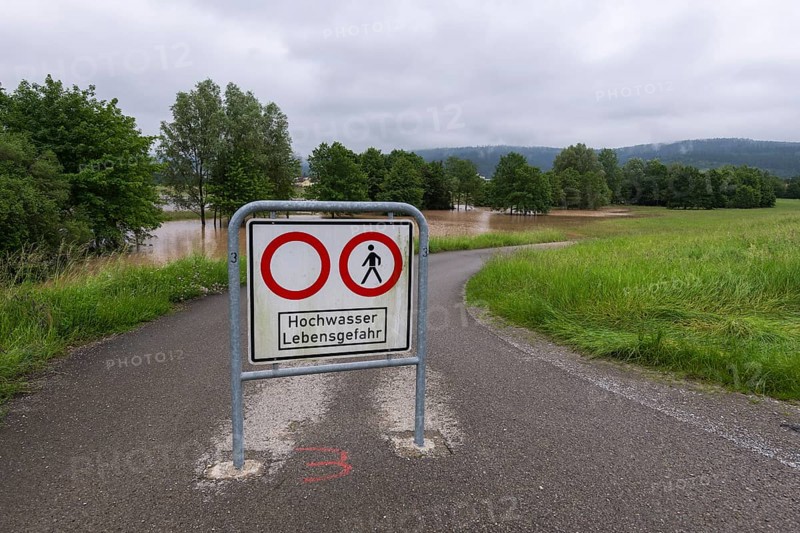 Symbolic image extreme weather, global warming, climate change, information board, flood retention basin, flood protection, danger to life, flooded meadows, deciduous trees, Rems valley, Winterbach, Rems river, Baden-Württemberg, Germany, Europe