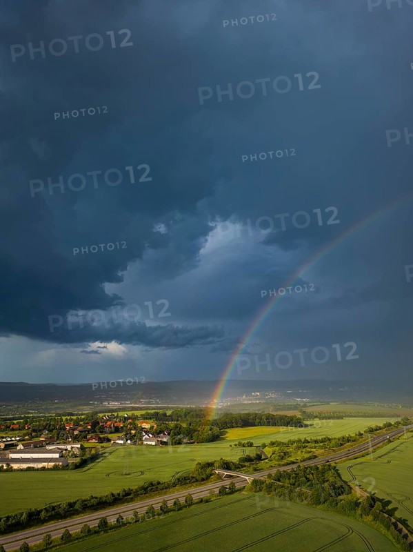 Thunderstorm cell with rainbow over fields near Krebs in the Osterzgebirge, Krebs, Saxony, Germany, Europe