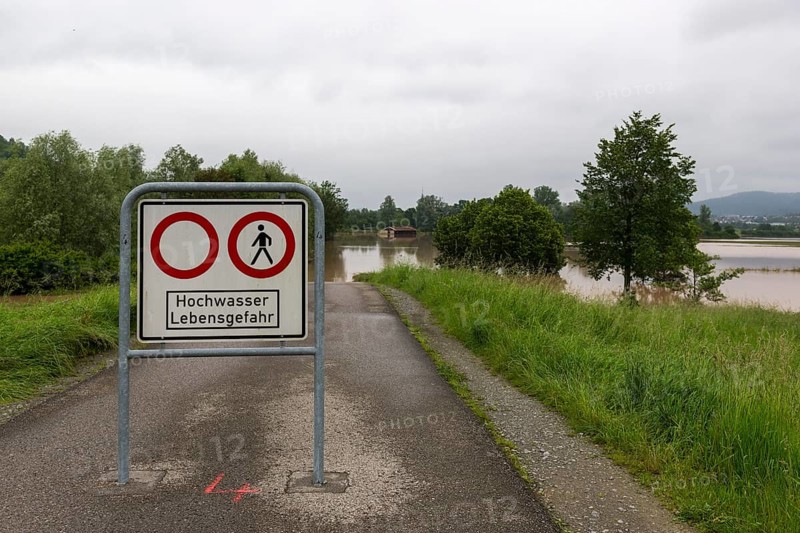 Symbolic image extreme weather, global warming, climate change, information board, flood retention basin, flood protection, danger to life, flooded meadows, deciduous trees, Rems valley, Winterbach, Rems river, Baden-Württemberg, Germany, Europe