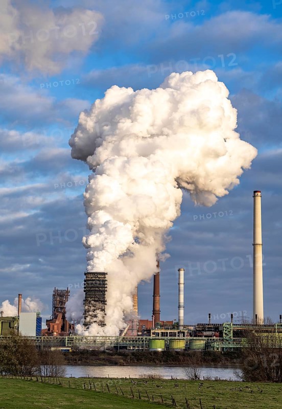 Industrial backdrop of the ThyssenKrupp Steel steelworks in Duisburg-Bruckhausen, on the Rhine, blast furnaces, Schwelgern coking plant, extinguishing cloud, Duisburg, North Rhine-Westphalia, Germany, Europe