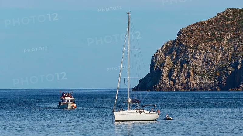 Sailing boat, excursion boat, rocky coast, Marettimo town, Marettimo, Egadi Islands, Sicily, Italy, Europe