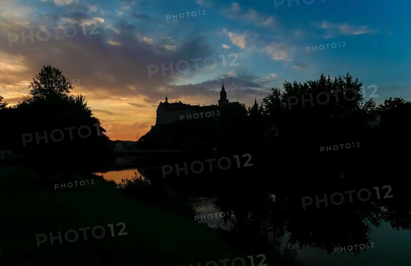 Hohenzollern Castle Sigmaringen, former princely residence and administrative centre of the Princes of Hohenzollern-Sigmaringen, city castle, architecture, historical building, west view, light mood, black silhouette, dramatic clouds, reflection, water, Danube, river, Sigmaringen, Upper Swabia, Baden-Württemberg, Germany, Europe