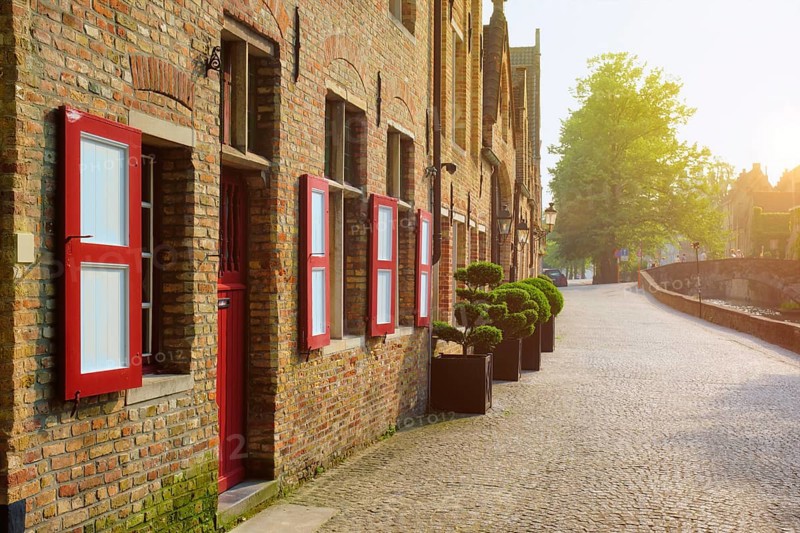 Door and windows of an old houses and street on sunset, Bruges (Brugge), Belgium, Europe